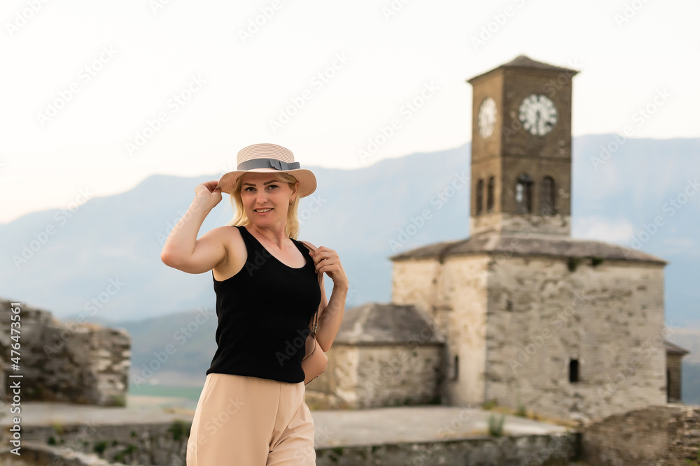 GJIROKASTER, ALBANIA. People enjoying the peaceful atmosphere in quarters of old city UNESCO World Heritage Site and popular tourist destination.
