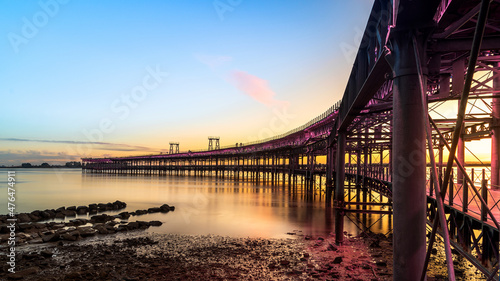 Panoramic view of the ore loading dock of the Rio Tinto mining company in Huelva, Andalusia, Spain. Sunset at the Muelle del Tinto photo