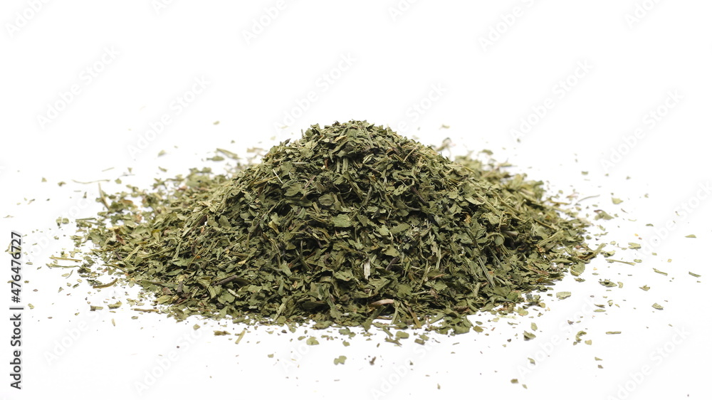 Chopped dry parsley leaves, pile isolated on white Chopped dry parsley leaves, pile isolated on white