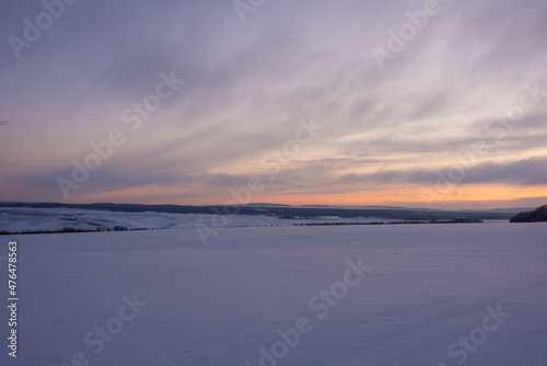 Northern steppe with snow. Sunrise.