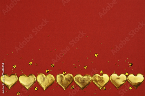 Golden hearts in a border a...