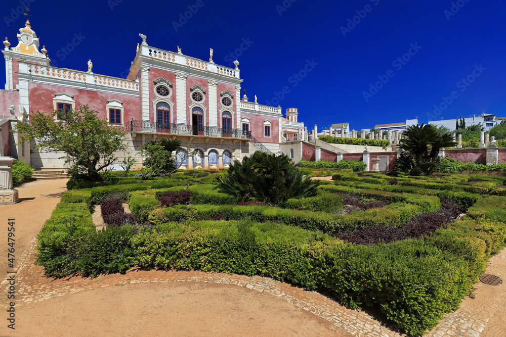 South fa?ade-neoRococo palace-gravel path-trimmed hedges-clock tower-long balcony-porthole windows-rooftop statues. Estoi-Algarve-Portugal-029