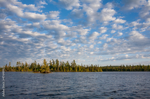 Lake in northern Minnesota with altocumulus clouds on a sunny afternoon photo