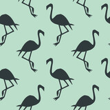 Seamless flamingo bird pattern. Repeated bark blue animal on green