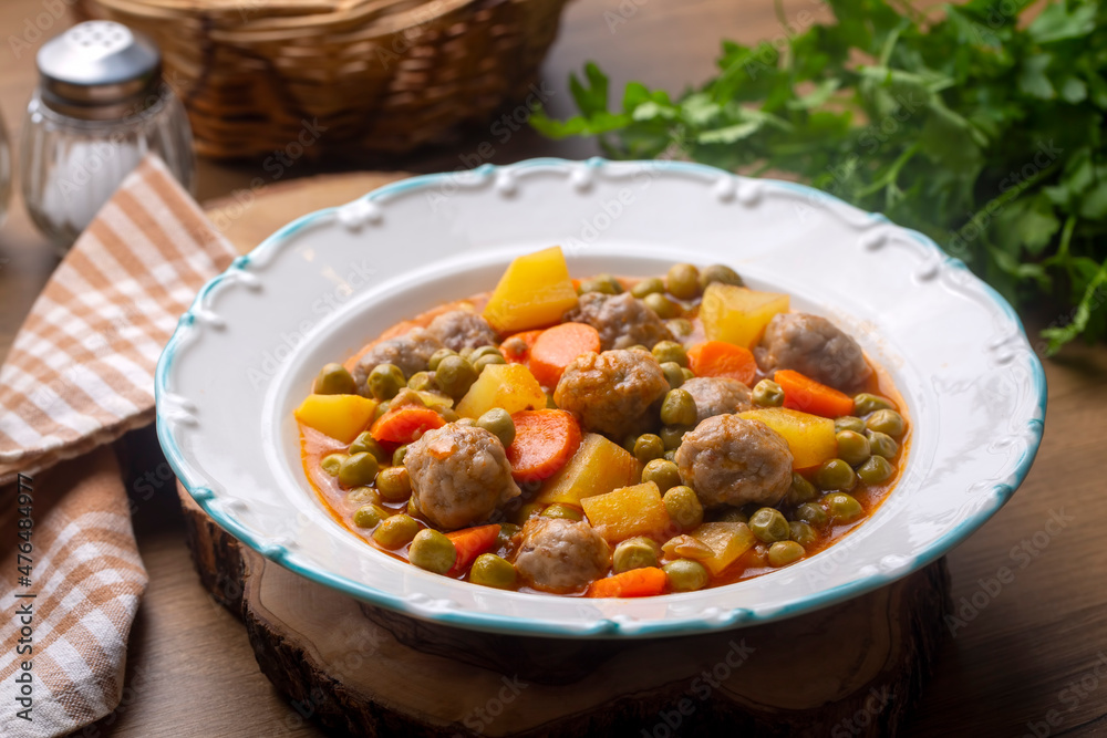 Turkish Food Green Pea Stew with Meatballs - Kofte or Kofta Bezelye. (Turkish name; kofteli bezelye) Turkish Food Green Pea Stew with Meatballs - Kofte or Kofta Bezelye. (Turkish name; kofteli bezelye)