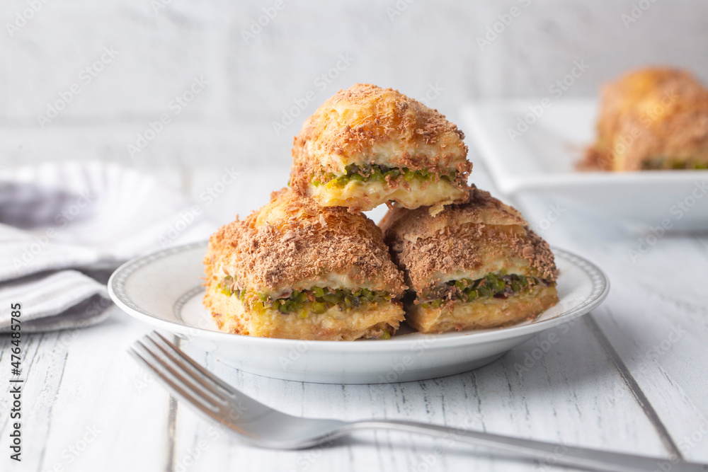 Traditional turkish new dessert cold milky baklava with pistachio (Turkish name; soguk baklava) Traditional turkish new dessert cold milky baklava with pistachio (Turkish name; soguk baklava)