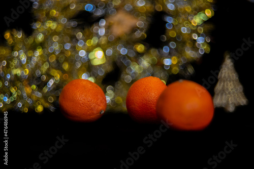 new year tangerines and garlands with bokeh