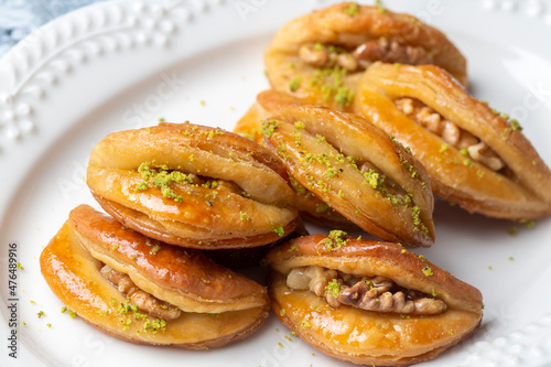Dilberdudagi with walnut, traditional feast and ramadan dessert with syrup (Turkish name; Dilber dudagi)