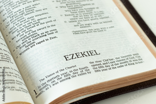 Ezekiel open Holy Bible Book. A close-up. Studying Old Testament prophesy from Scripture. Christian biblical concept.