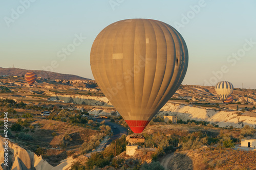 Hot-air balloons flying over the mountain landsape of Cappadocia,Turkey
