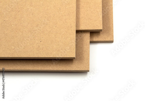 Raw MDF boards set on a white background.