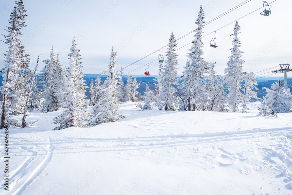 Winter landscape in Sheregesh ski resort in Russia, located in Mountain Shoriya, Siberia. Snow-covered fir trees on the background of mountains Winter landscape in Sheregesh ski resort in Russia, located in Mountain Shoriya, Siberia. Snow-covered fir trees on the background of mountains