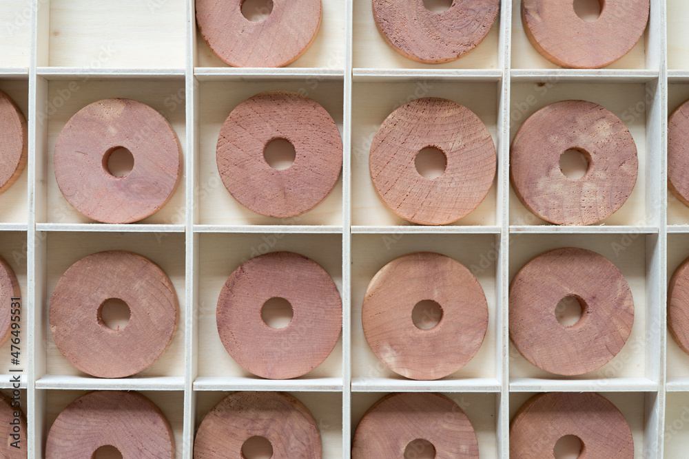 Fototapeta premium cedar wood hanger rings arranged in a box