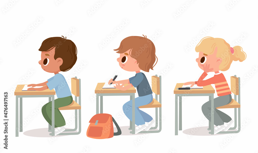 Elementary school pupils study in the classroom seating at the desks