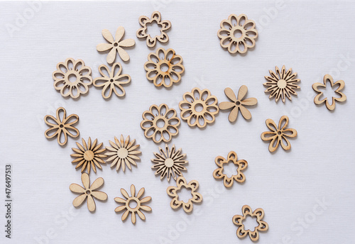 scattered laser cut florals on textured paper