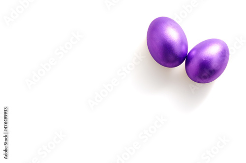 Purple easter eggs on white background with copy space for text. Colour of the year 2022.