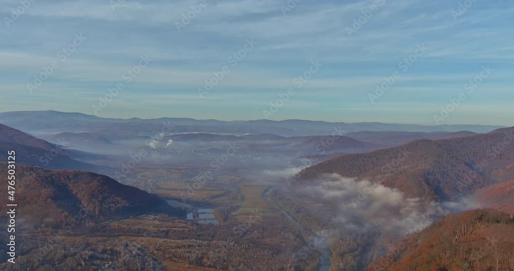 Aerial drone view morning view to misty over autumn forest mountains Aerial drone view morning view to misty over autumn forest mountains