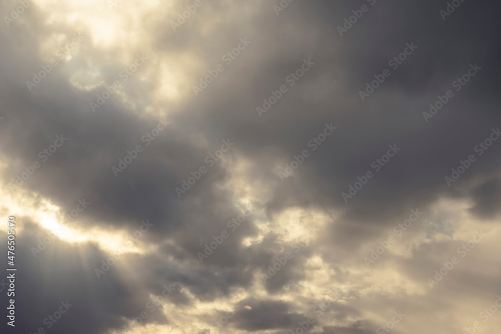 Dramatic dark cloudy sky with sun rays. Nature background. Dramatic dark cloudy sky with sun rays. Nature background.