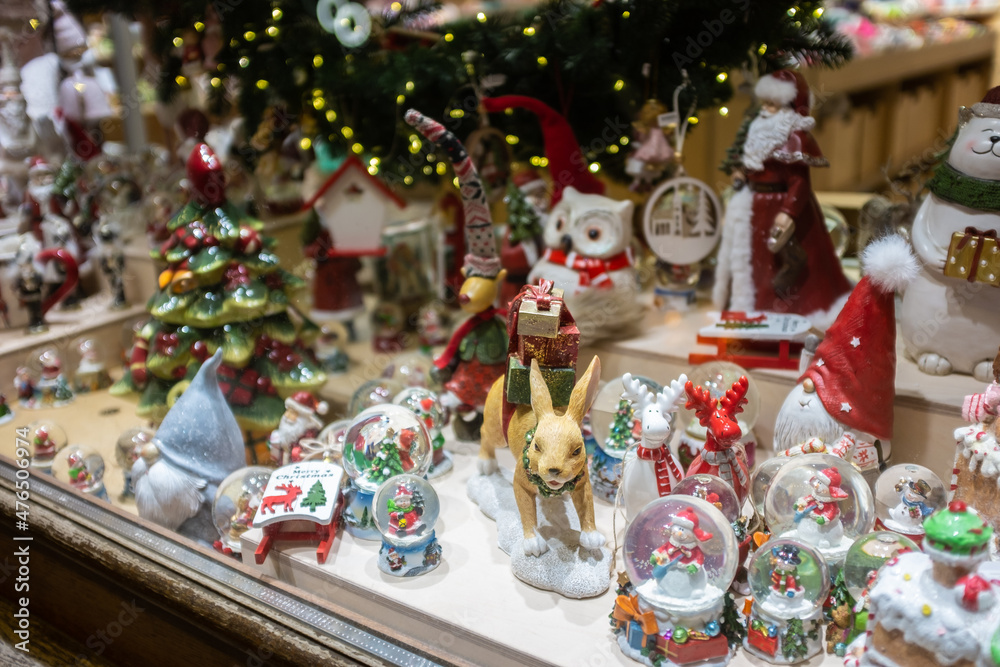 Santa Claus, glass snowball, Christmas decorations in a shop window in Lviv, Ukraine.