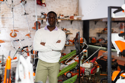 Portrait of african american salesman at gardening tools store