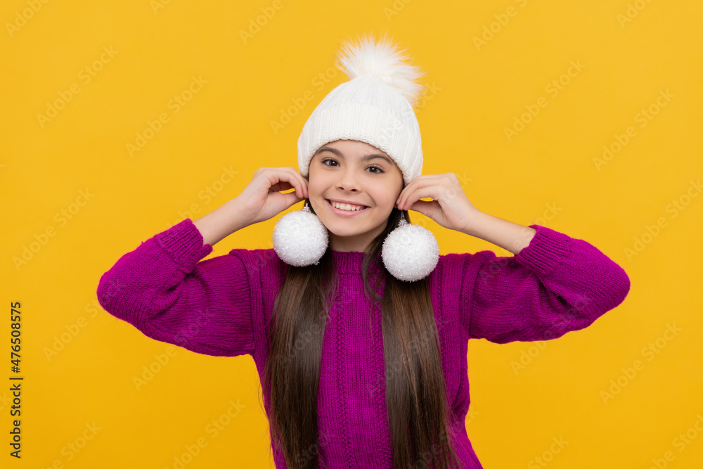 cheerful kid in hat with snowballs on yellow background, christmas cheerful kid in hat with snowballs on yellow background, christmas