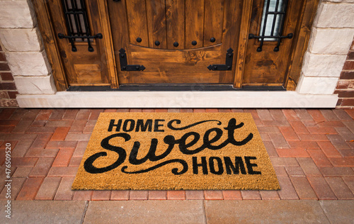Home Sweet Home Welcome Mat At Custom Front Door of House.