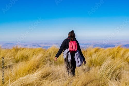 woman walking from esplada makes trekking in a mountain photo
