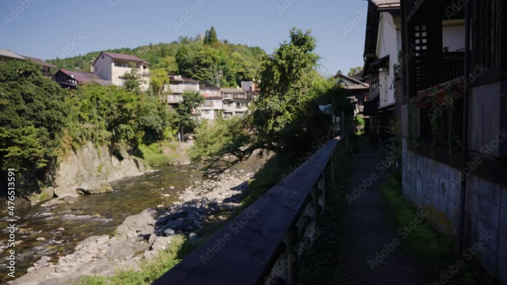 Japanese Homes Along the Yoshida River in Gujo Hachiman City, Warm Summer Day Japanese Homes Along the Yoshida River in Gujo Hachiman City, Warm Summer Day