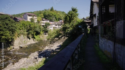 Japanese Homes Along the Yoshida River in Gujo Hachiman City, Warm Summer Day photo