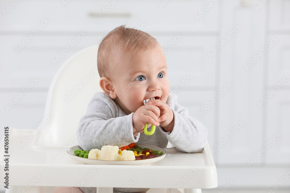 Cute little baby eating healthy food at home Cute little baby eating healthy food at home