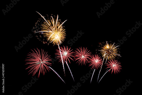 Many flashing colorful fireworks in event amazing with black background celebrate New Year  holiday and festival in night.