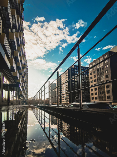 urban landscape with a blue sky and reflection
