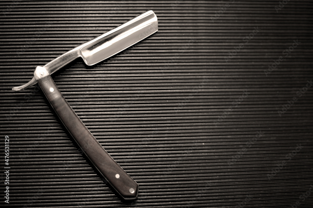Obraz premium barber tool straight razor close in retro vintage style. Black and white picture