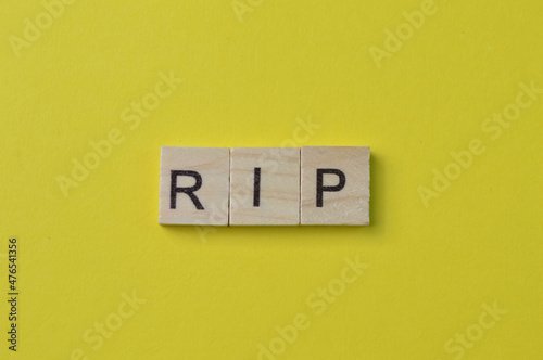 Wooden square letters with text RIP stands for Rest In Peace