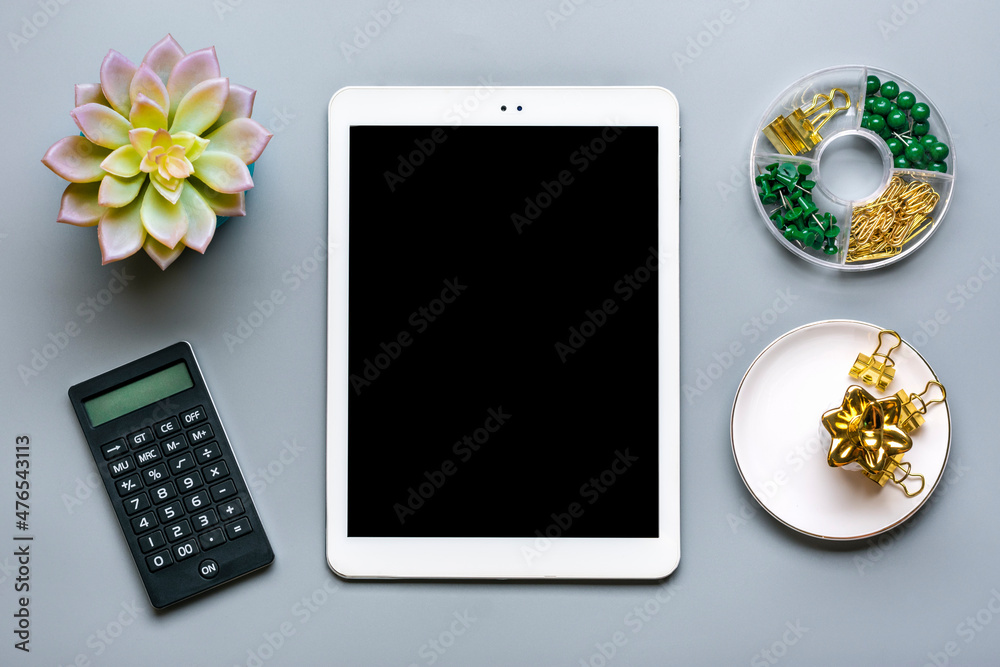 digital tablet with black screen, piggy bank, calculator, succulent, notebook on gray background Business, insurance, technology concept Top view Flat lay Mock up Home workplace digital tablet with black screen, piggy bank, calculator, succulent, notebook on gray background Business, insurance, technology concept Top view Flat lay Mock up Home workplace