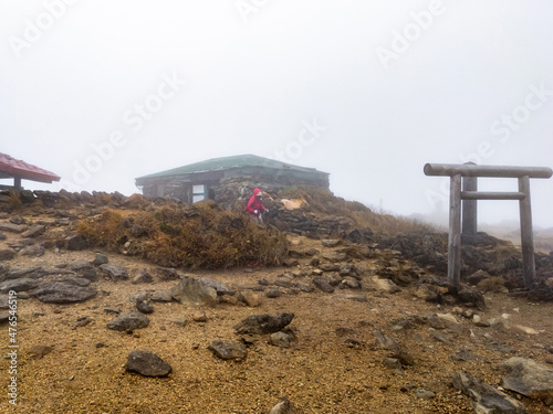 Refuge hut at the top of mountain in a fog (Zao, Yamagata, Japan)