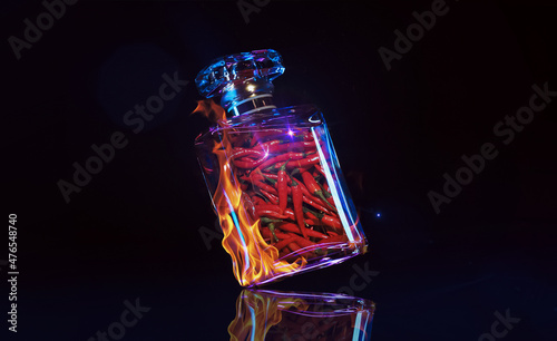 A bottle of fragrance made with red chilli isolated on a black background with neon lights