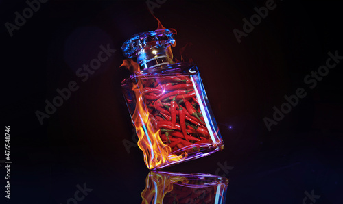 A bottle of fragrance made with red chilli isolated on a black background with neon lights