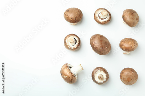 Flat lay composition with champignons on white background