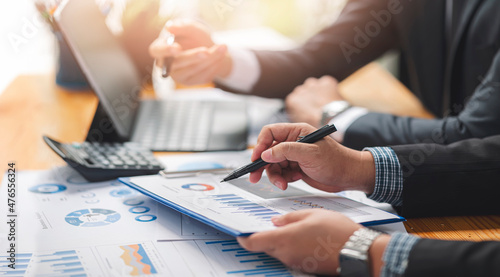 businessman working at office with his colleague at office, doing planning analyzing the financial report, business plan investment, finance analysis concept.