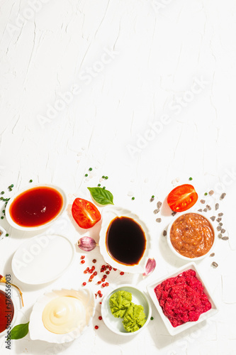 Set of different sauces - ketchup, mayonnaise, barbecue, soy, chutney, wasabi, adjika, horseradish photo