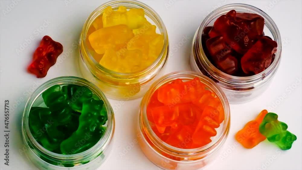The child eats vitamins jelly candy. Selective focus. The child eats vitamins jelly candy. Selective focus.