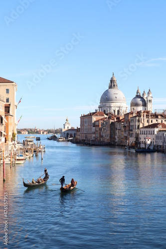 Beautiful view of Grand Canal with Venetian gondolas on a sunny day in Venice, Italy