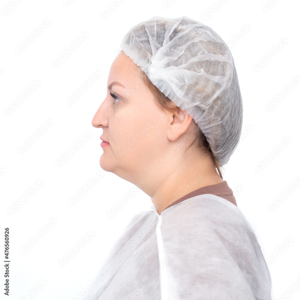 Full-face portrait of a young woman in a medical cap before cosmetic procedures isolated on a white background Full-face portrait of a young woman in a medical cap before cosmetic procedures isolated on a white background