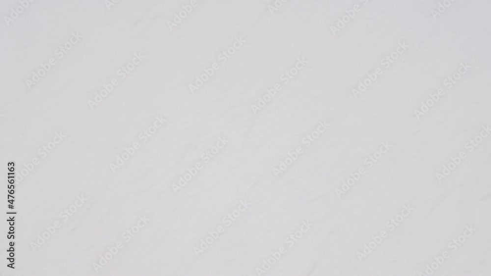 4K: Blurred background of fast-falling snowflakes, snowfall in winter, strong storm, place for text 4K: Blurred background of fast-falling snowflakes, snowfall in winter, strong storm, place for text