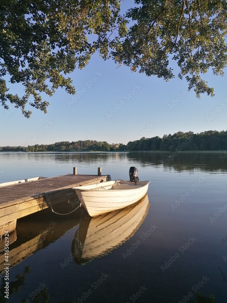 Sailing in a small boat in Lake Mälaren in during sunset in Stockholm, Sweden