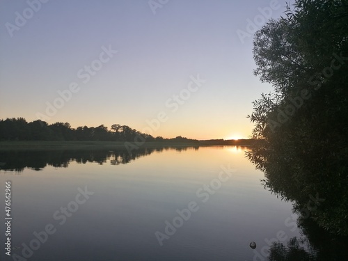 Sailing in a small boat in Lake M  laren in during sunset in Stockholm  Sweden