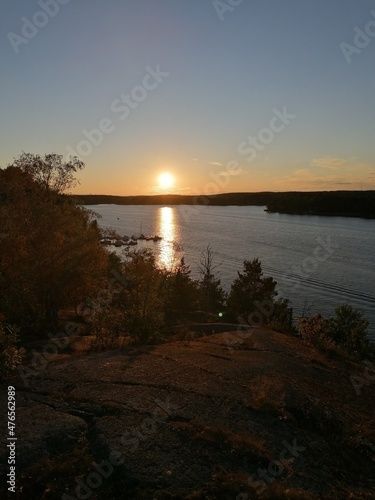 Sailing in a small boat in Lake Mälaren in during sunset in Stockholm, Sweden