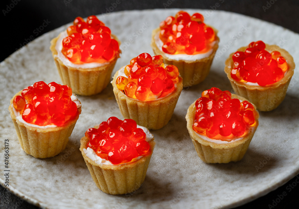 Red caviar in tartlets, close up Red caviar in tartlets, close up