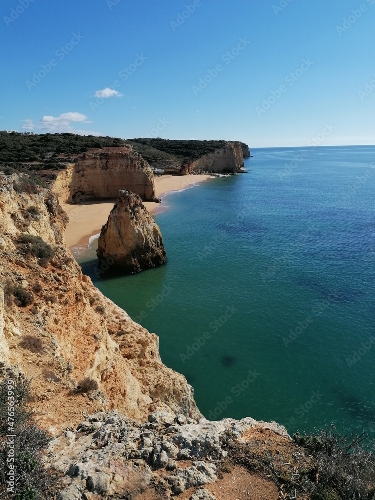 The stunning beautiful coastline landscapes along the Algarve in Portugal during sunset The stunning beautiful coastline landscapes along the Algarve in Portugal during sunset